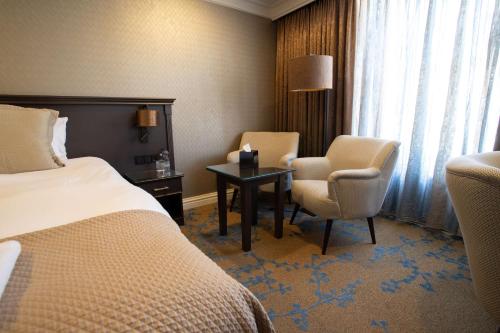 Кровать или кровати в номере Good Seasons Hotel Den Bosch
