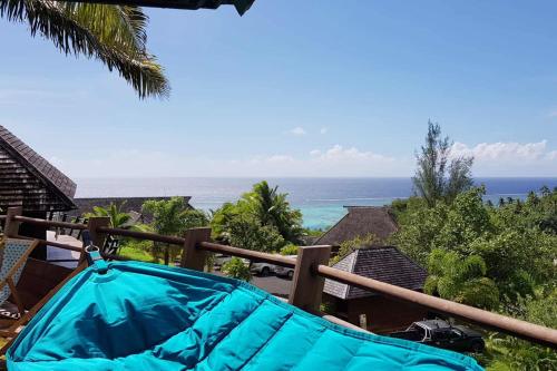 a view of the ocean from the balcony of a resort at Villa Anuanua by Tahiti Homes in Papetoai