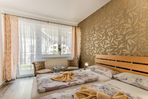 מיטה או מיטות בחדר ב-Penzion Blesk