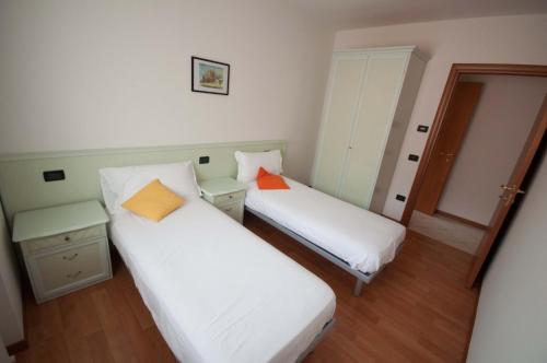 Ένα ή περισσότερα κρεβάτια σε δωμάτιο στο Castel View Apartment - Gardaslowemotion