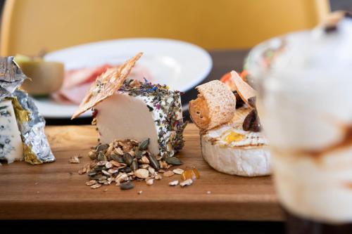 a wooden cutting board with some food on it at Waterfront in Sliema