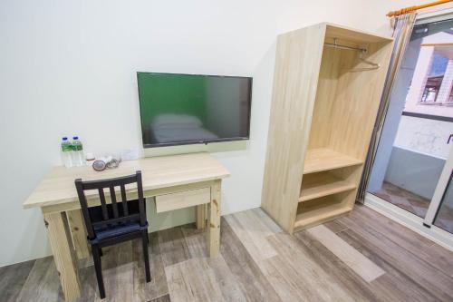 TV a/nebo společenská místnost v ubytování Fantasy Homestay