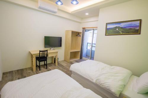 Postel nebo postele na pokoji v ubytování Fantasy Homestay
