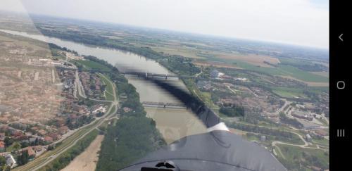 a view of a river from the wing of an airplane at Da Santo Hotel Ristorante Pizzeria in Ferrara