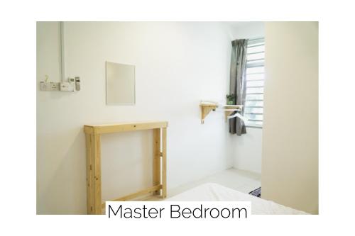 a bathroom with a mirror and a wooden table at Cozy, Modern, Air Cond Gambang Water Park Homestay -- The Pigeon Guest House in Kampong Pohoi