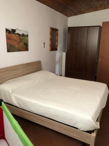 a bedroom with a bed in a room at Casetta Mondello in Mondello