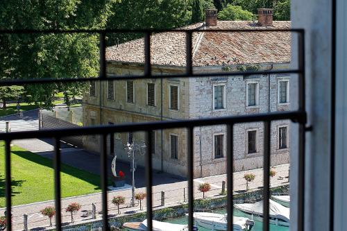 a view of a building from a window at Hotel Bell'arrivo by Dori in Peschiera del Garda