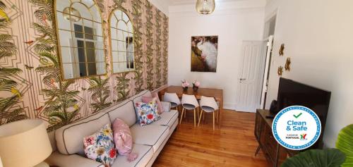 a living room with a couch and a table at Monte Agudo Angola 45 in Lisbon