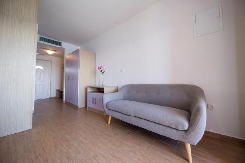 a living room with a couch in a room at Pension Augustino in Ražanac