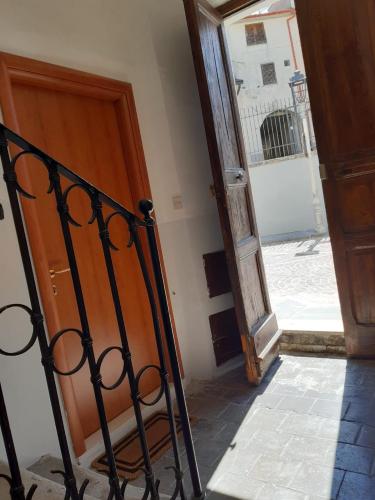 an entrance to a building with a wooden door at IL TEMPO in Aielli