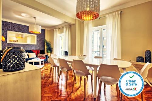 a dining room with a table and chairs at Almirante 3-Four Bedrooms in Lisbon