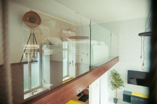 a staircase with a glass wall in a room at Zeus Design Loft Apartments in Vienna
