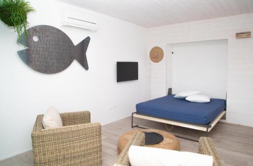 Postel nebo postele na pokoji v ubytování MARINA PONENTE