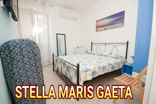 a bedroom with a bed and a chair in a room at STELLA MARIS GAETA in Gaeta