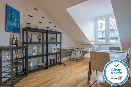 a living room with a shelf with wine bottles at Downtown Boutique Duplex in Lisbon