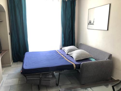 A bed or beds in a room at appartement Breil sur Roya centre