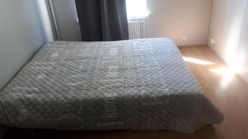 a bed in a small room with a mattress at Asemantupa 1 in Pyhäsalmi