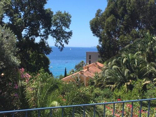 a view of the ocean from a house at Villa Olivea in Rayol-Canadel-sur-Mer