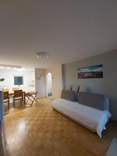 a bedroom with a bed and a dining room at Apartma Arnež in Bled