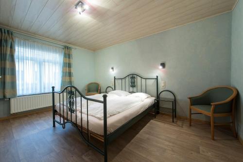 Postel nebo postele na pokoji v ubytování Appart Hotel Au Pied de Vigne