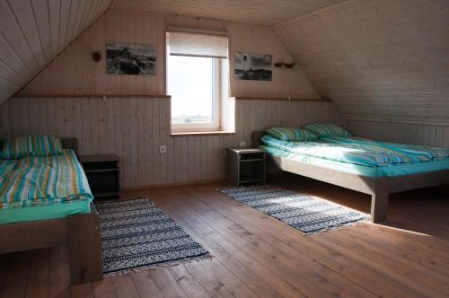 Posteľ alebo postele v izbe v ubytovaní Kaluri puhkemaja