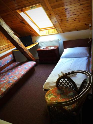 Postel nebo postele na pokoji v ubytování Hostinec Selský dvůr