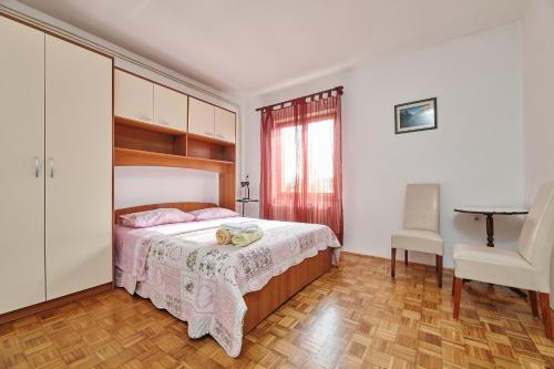 Posteľ alebo postele v izbe v ubytovaní APARTMENT CAR UMAG 3