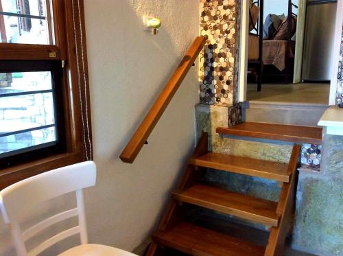 a staircase in a house with a stair case at Mare Nostrum in Neos Marmaras