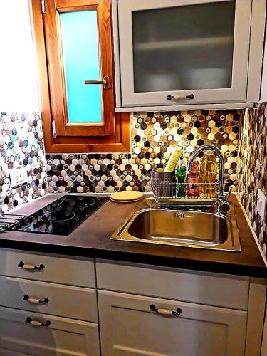 a kitchen with a sink and a counter top at Mare Nostrum in Neos Marmaras