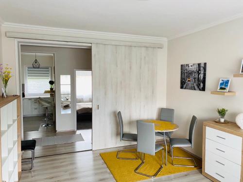 a kitchen and dining room with a table and chairs at Sweet Central Apartment ,in the City center in Eger
