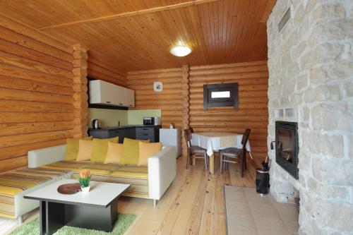 a living room with a couch and a table at Hotel Panorama in Panichishte