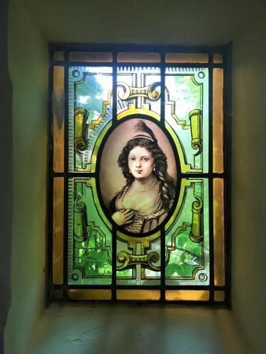 a stained glass window with a picture of a girl at Seulle State in Sint Jacobiparochie