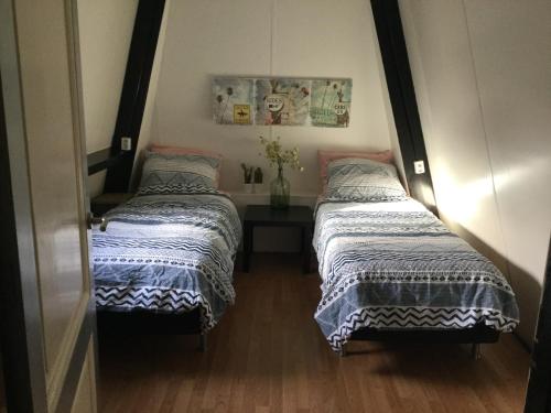 Katil atau katil-katil dalam bilik di Beemster Experience