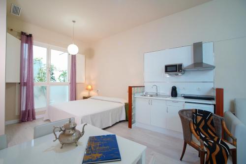 Кровать или кровати в номере Casa Palacio Cádiz by Luxury Suites Cadiz