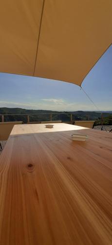 a view from the inside of a tent with a wooden floor at B&B Mermaid n 16/a in Treiso