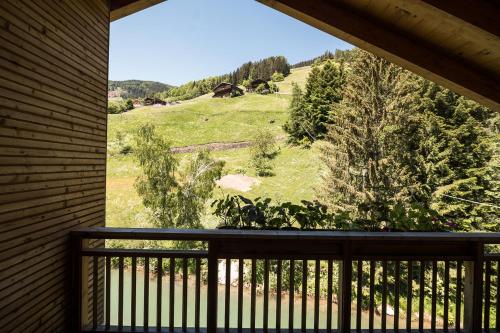 a balcony with a view of a green field at Guesthouse St Nikolaus in Ultimo