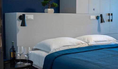 Ένα ή περισσότερα κρεβάτια σε δωμάτιο στο Hotel Blue