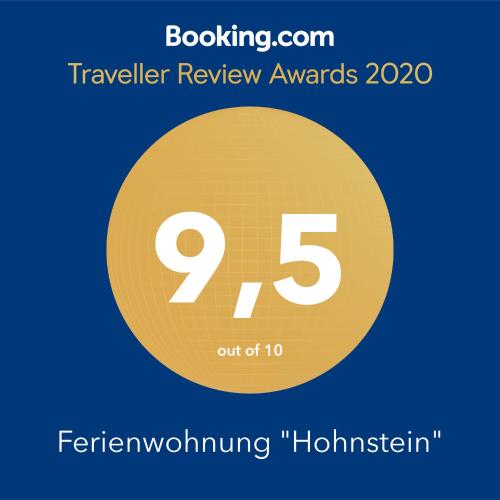 a yellow circle with the number nine and the text travelling review awards at Ferienwohnung "WILLI" in Hohnstein