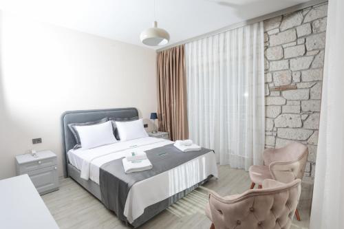 Ένα ή περισσότερα κρεβάτια σε δωμάτιο στο Neva Hotel Alaçatı