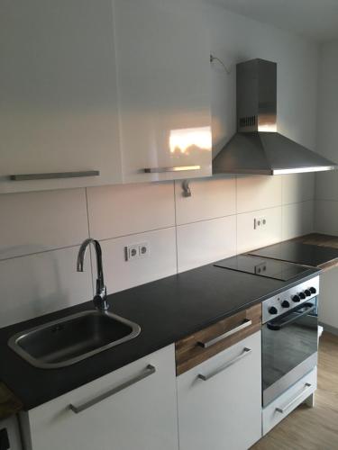 a kitchen with a sink and a counter top at en voquE in Braunschweig