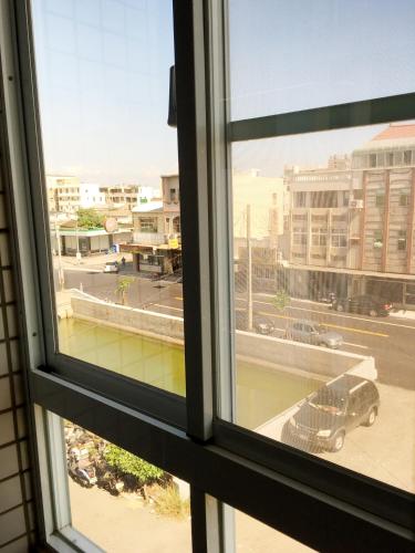 a view of a city from a window at 瑞恒行館Reui Heng Guesthouse in Budai
