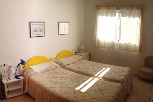 Postel nebo postele na pokoji v ubytování Apartamento vacaciones en Gemelos 22