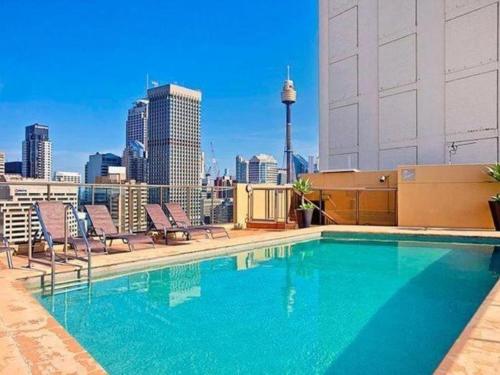 The swimming pool at or close to Accommodation Sydney Studio with balcony apartment