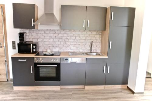 Dapur atau dapur kecil di Dom-i-Ziel Apartments