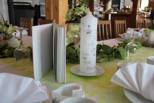 a table with two white vases on top of it at Berghäusel in Löbau