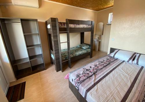 a bedroom with two bunk beds in a room at Катюша морская in Zatoka