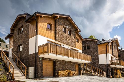 a large house with a balcony on the side of it at Horská Chata Ostružiny in Donovaly