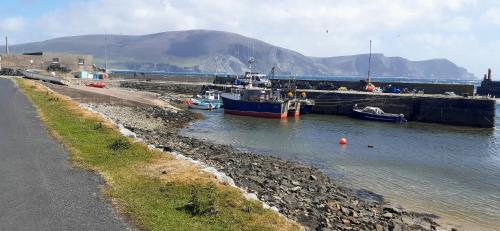 two boats are docked in a body of water at Creevagh (Room Only) in Keel