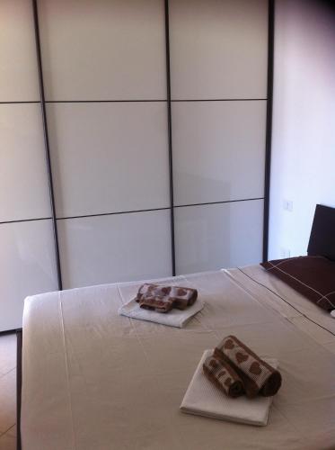 two towels are sitting on a white table at Casa Malù in Pula