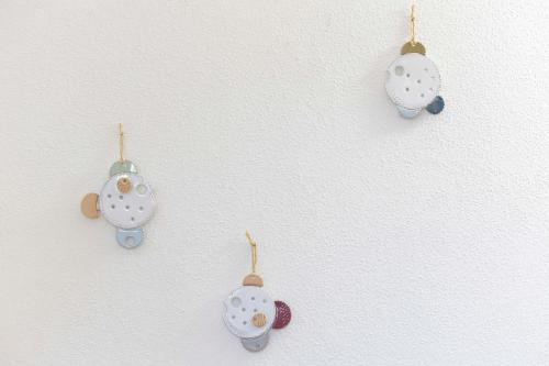 a group of four ornaments hanging on a wall at Bio&B Acquaviva in Otranto